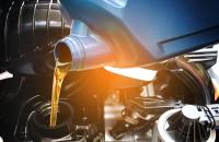 oil being poured into car change with light gradient overlay
